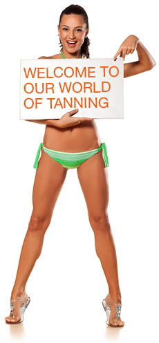 Bikini girl holding a sign saying welcome to our world of tanning